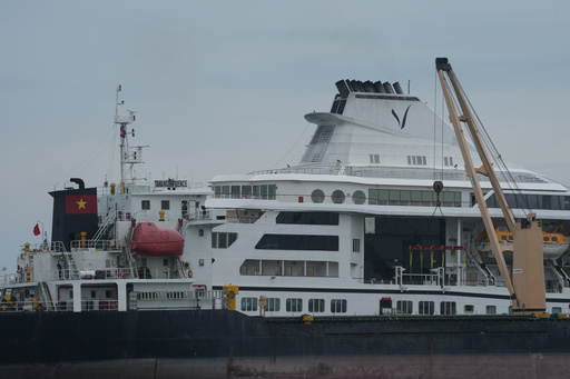A US cruise ship ends a global voyage in Asia due to fuel costs and 200 passengers lose their homes