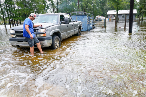 Former Tropical Storm Edouard lingers over Texas, flooding homes and roadways