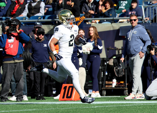 Carr passes for 2 TDs, James adds pair of rushing scores in No. 5 Notre Dame's 35-13 win over Navy